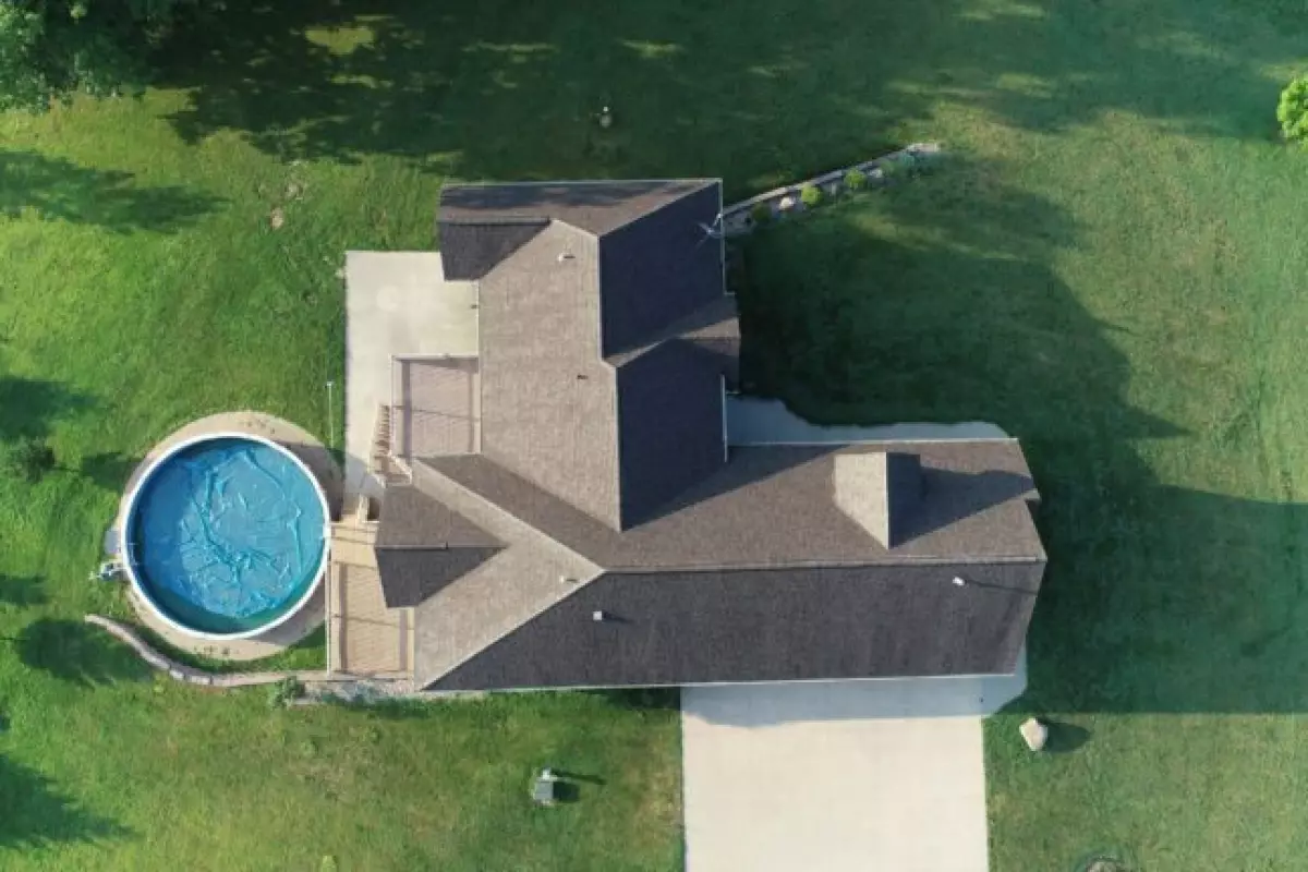 Bird’s Eye View: A Drone Captures the Stunning Aerial Perspective of a Secluded House. Image Credit: James Patrick/Shutterstock