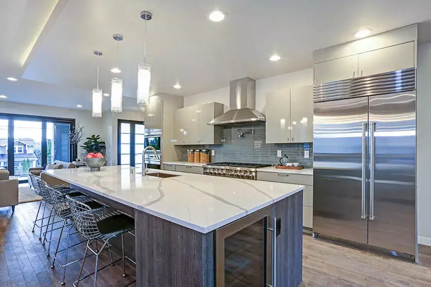 Kitchen with two-tone high gloss cabinets brown and gray island