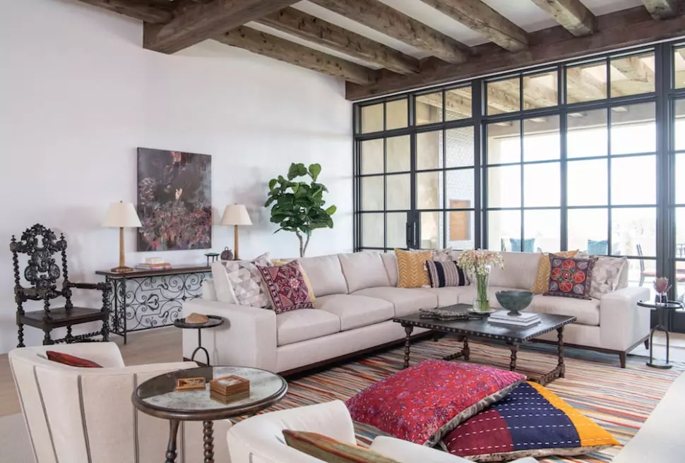 The living room in Camino Haciendas home with cocktail tables featuring custom stone inlays