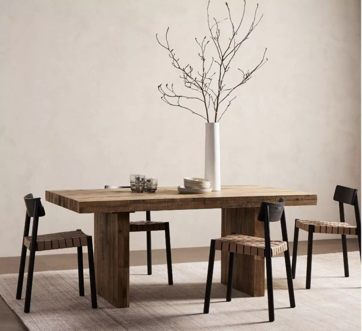 wooden extendable dining table with 4 modern chairs.