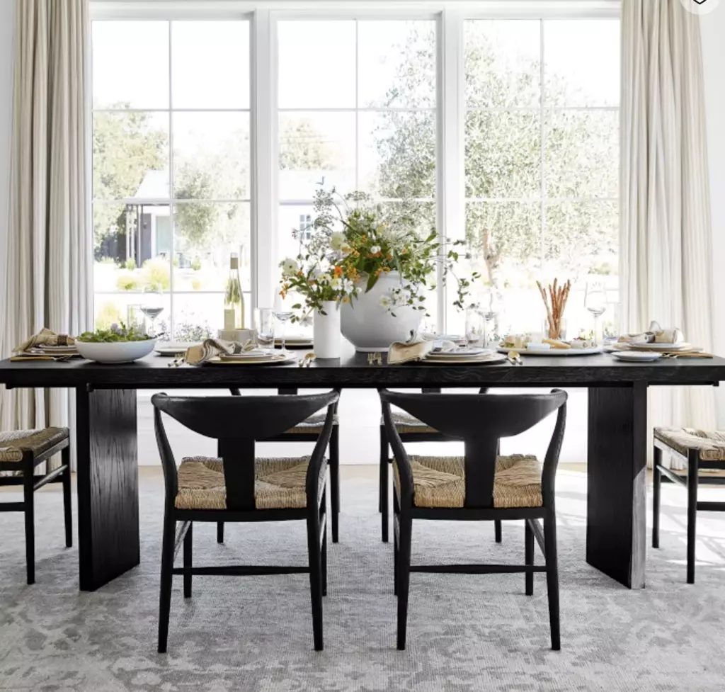 modern extendable dining table that is in a modern space.