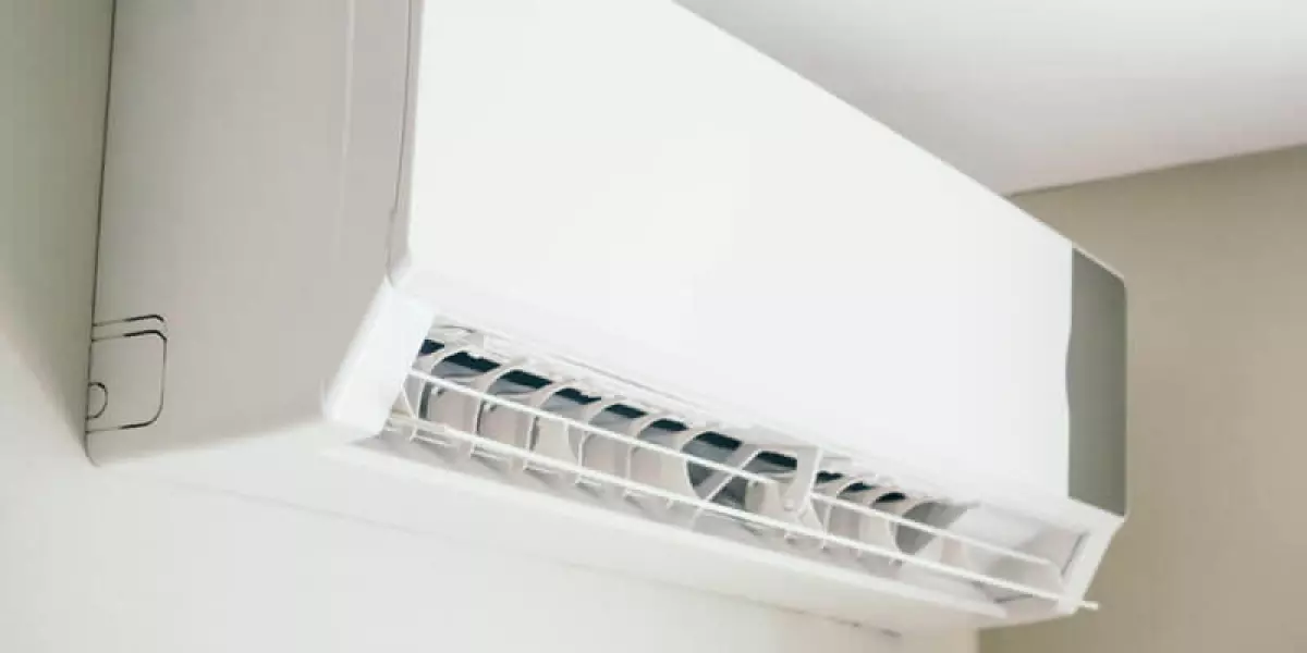 mini split ac unit mounted on indoor wall