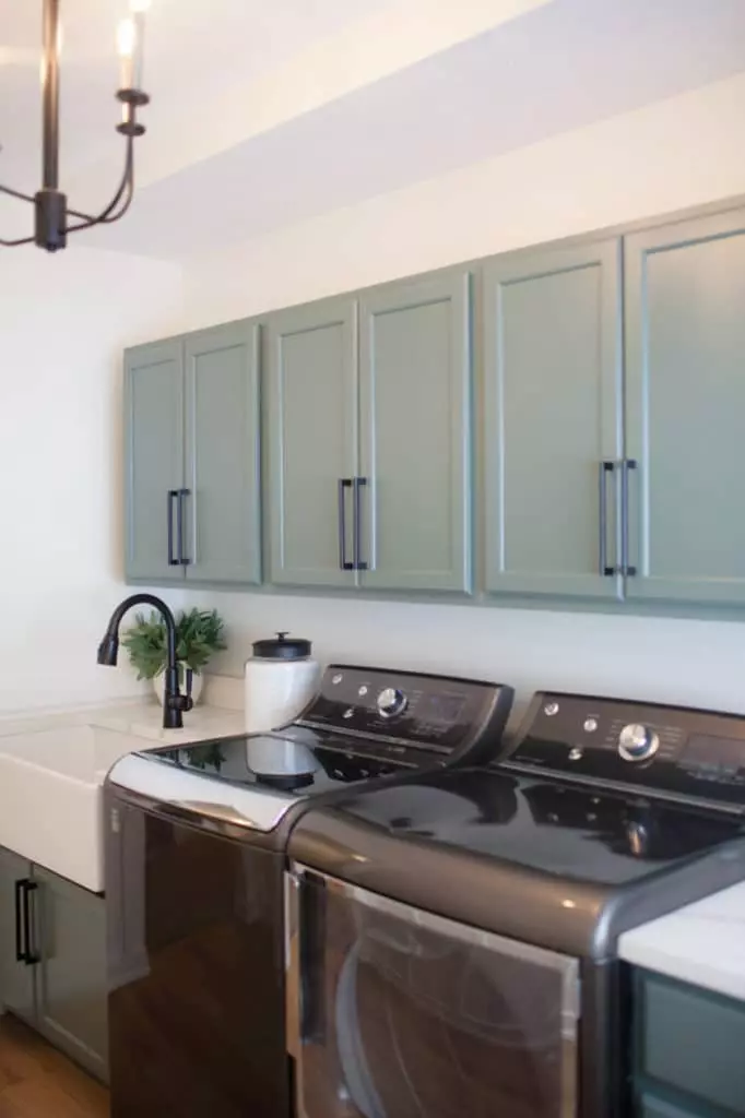 Benjamin Moore Caldwell Green cabinets. Washer and dryer and quartz, farmhouse sink. White Dove walls Kylie M Interiors Edesign, client photo. DIY UPDATE IDEAS