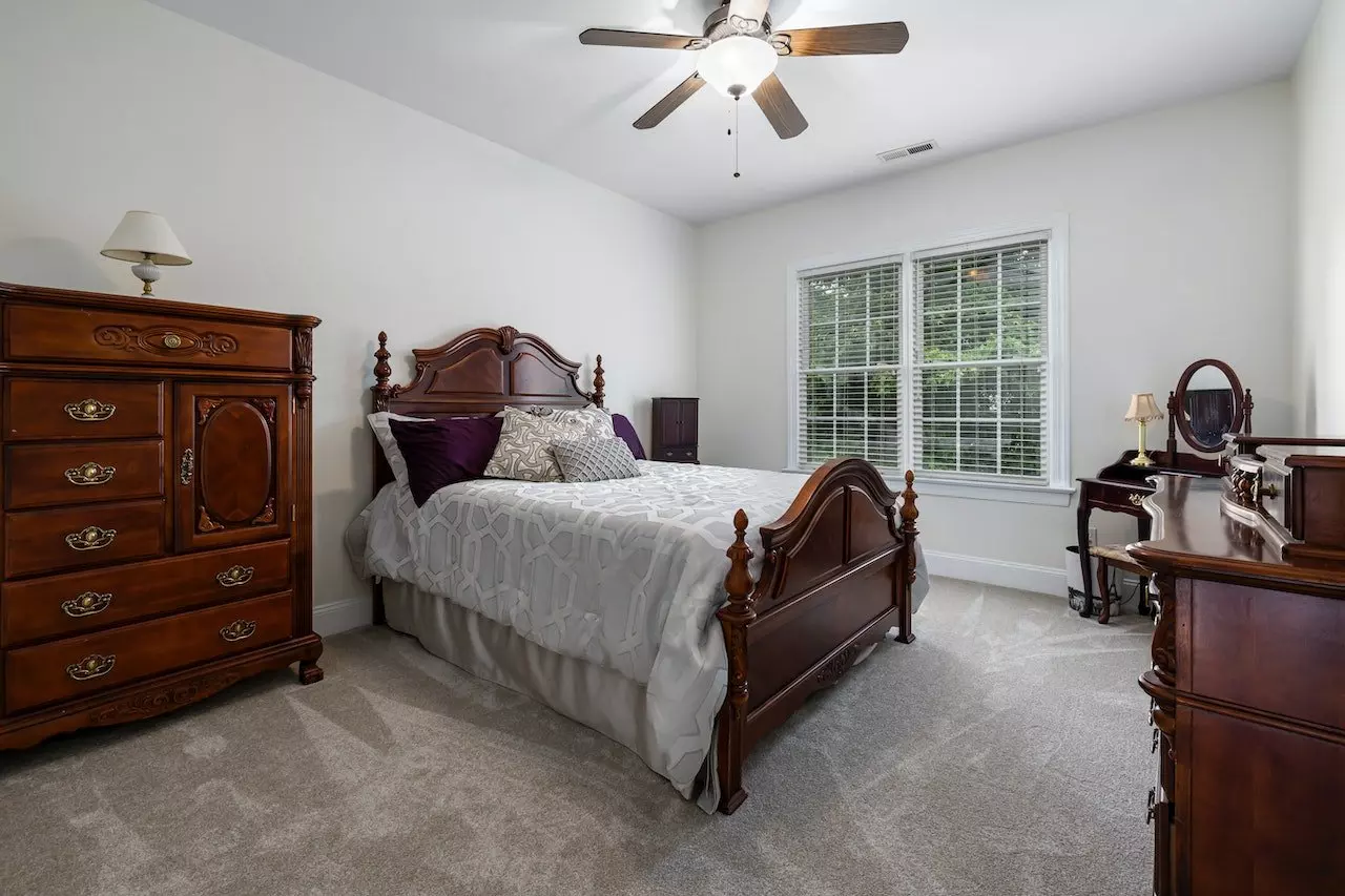 colonial style charm with wooden headboard