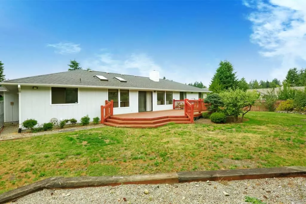 A stunning and breathtaking ranch house with mint green painted wooden sidings