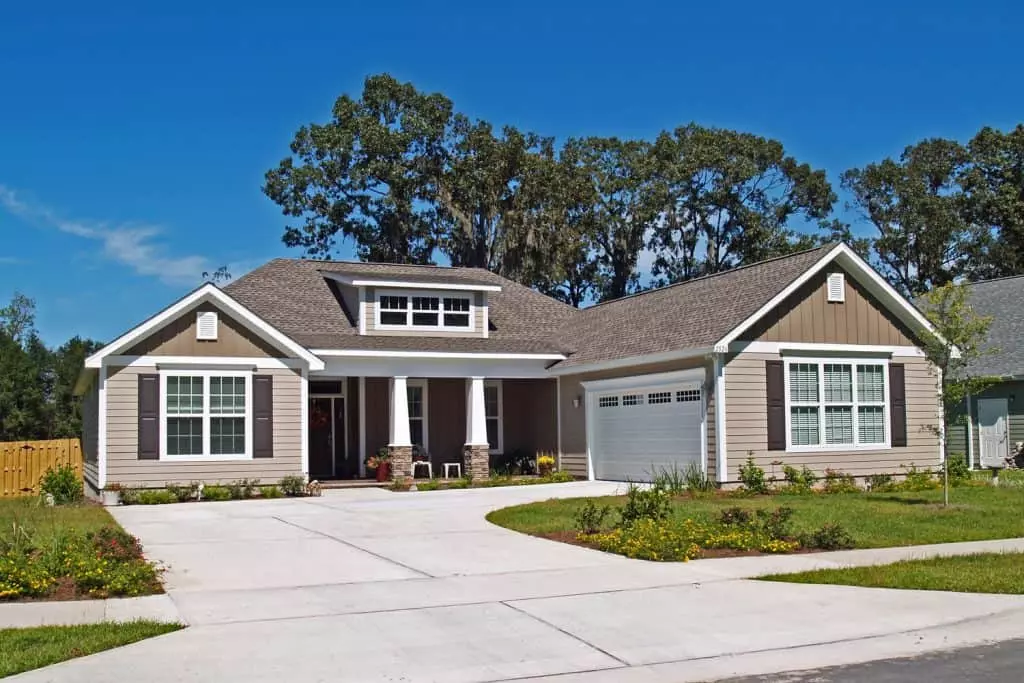 A good-looking ranch-style house with green painted wooden sidings