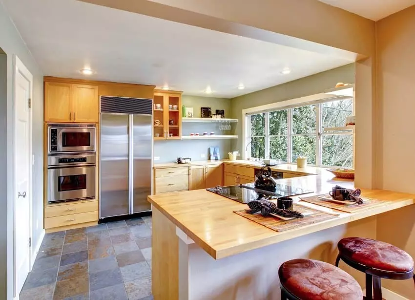 Kitchen with maple recessed cabinets and center island