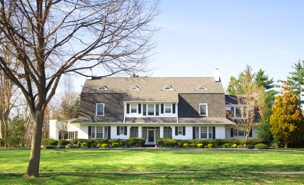 Colonial House with Picket Fence