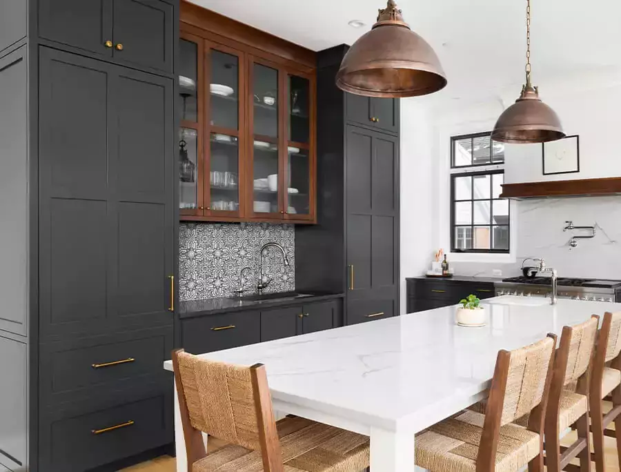 Traditional kitchen with grey Shaker style cabinets.