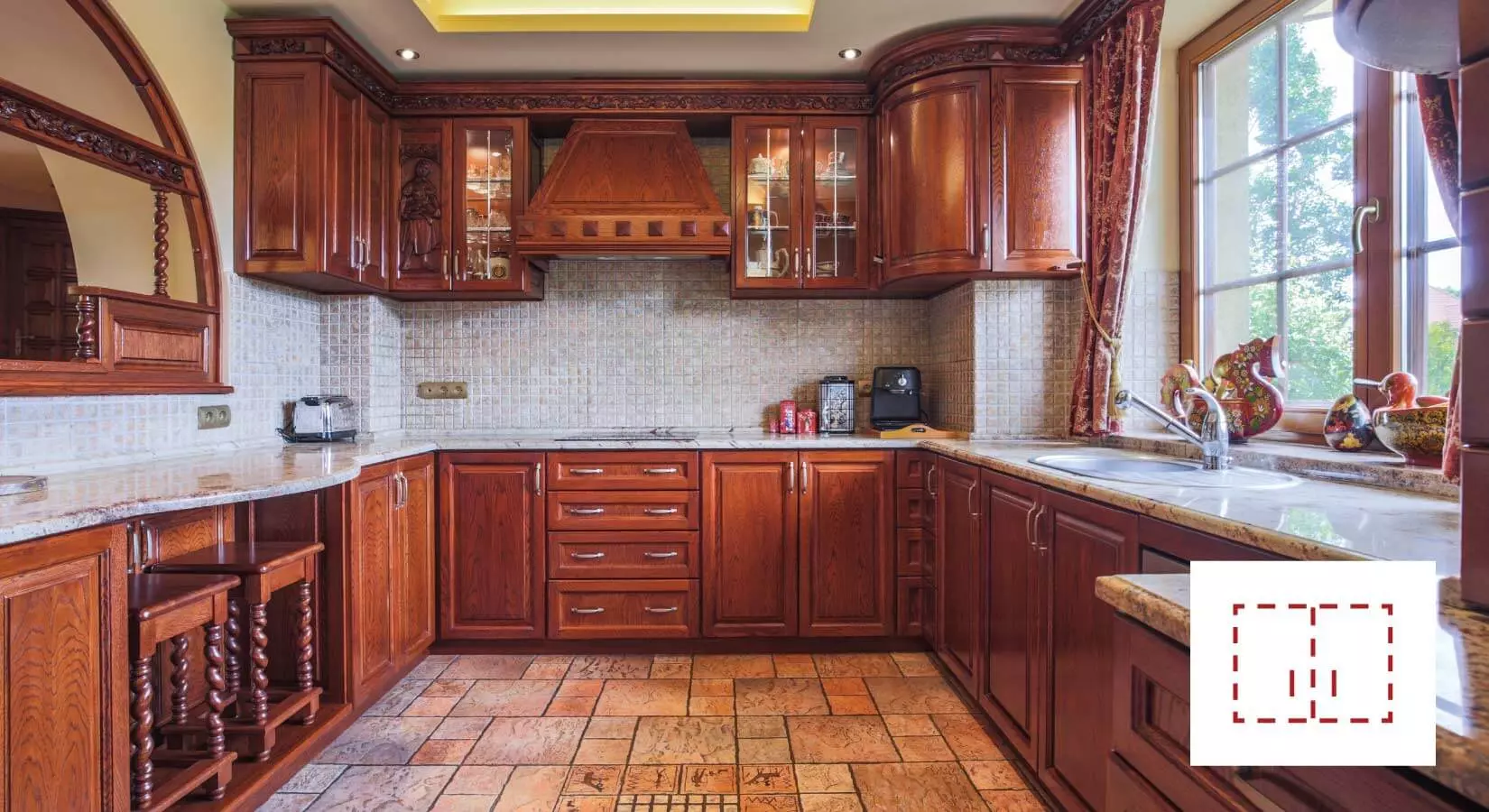 Intricate oak custom kitchen cabinets with spiral accents and crown molding.