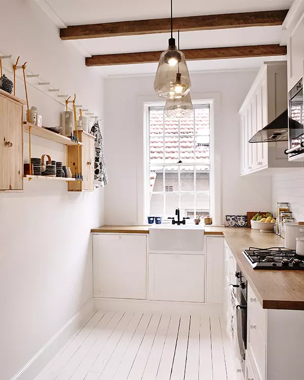 Light and bright small kitchen with painted white floors