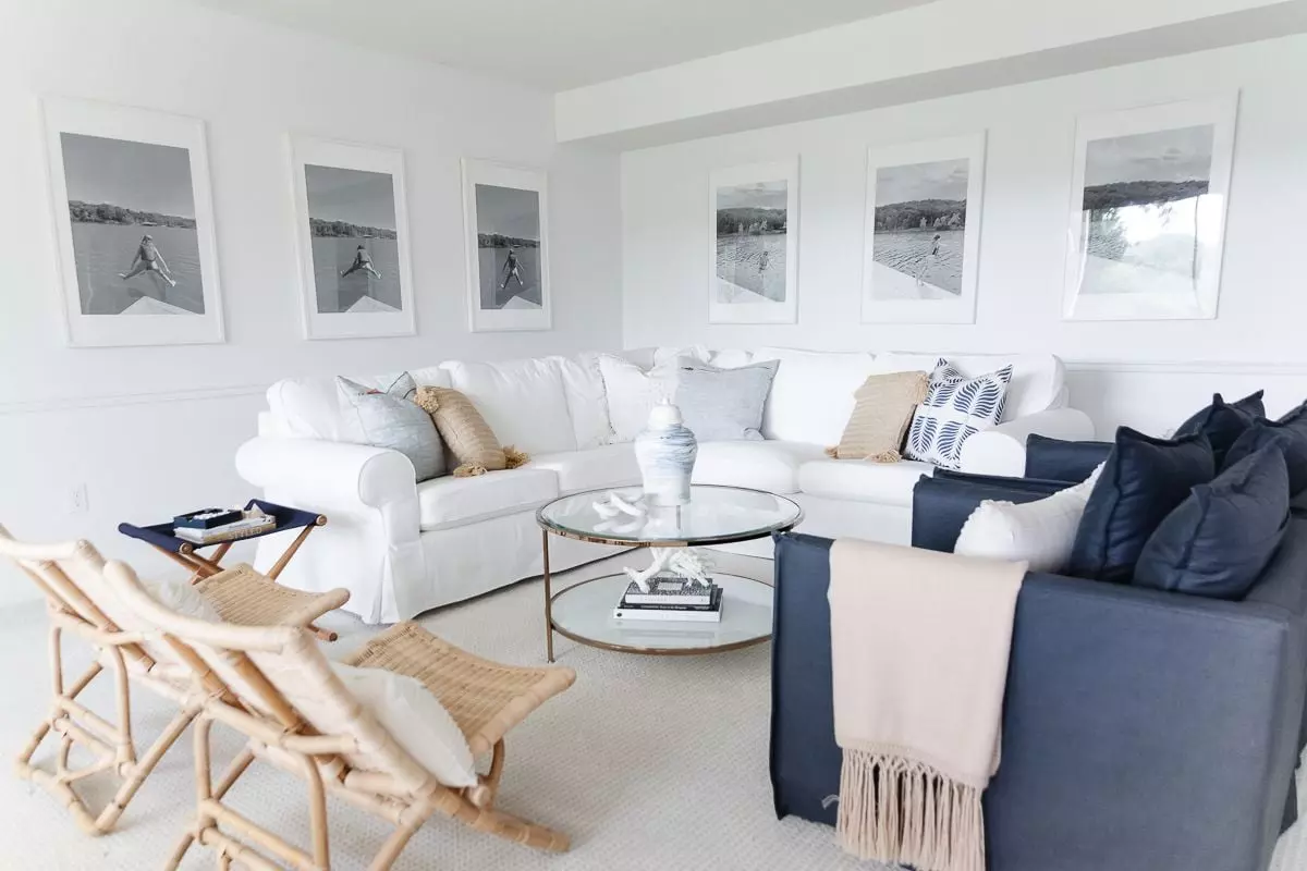 Textured pillows on a white sofa, in pale pastel whites and creams