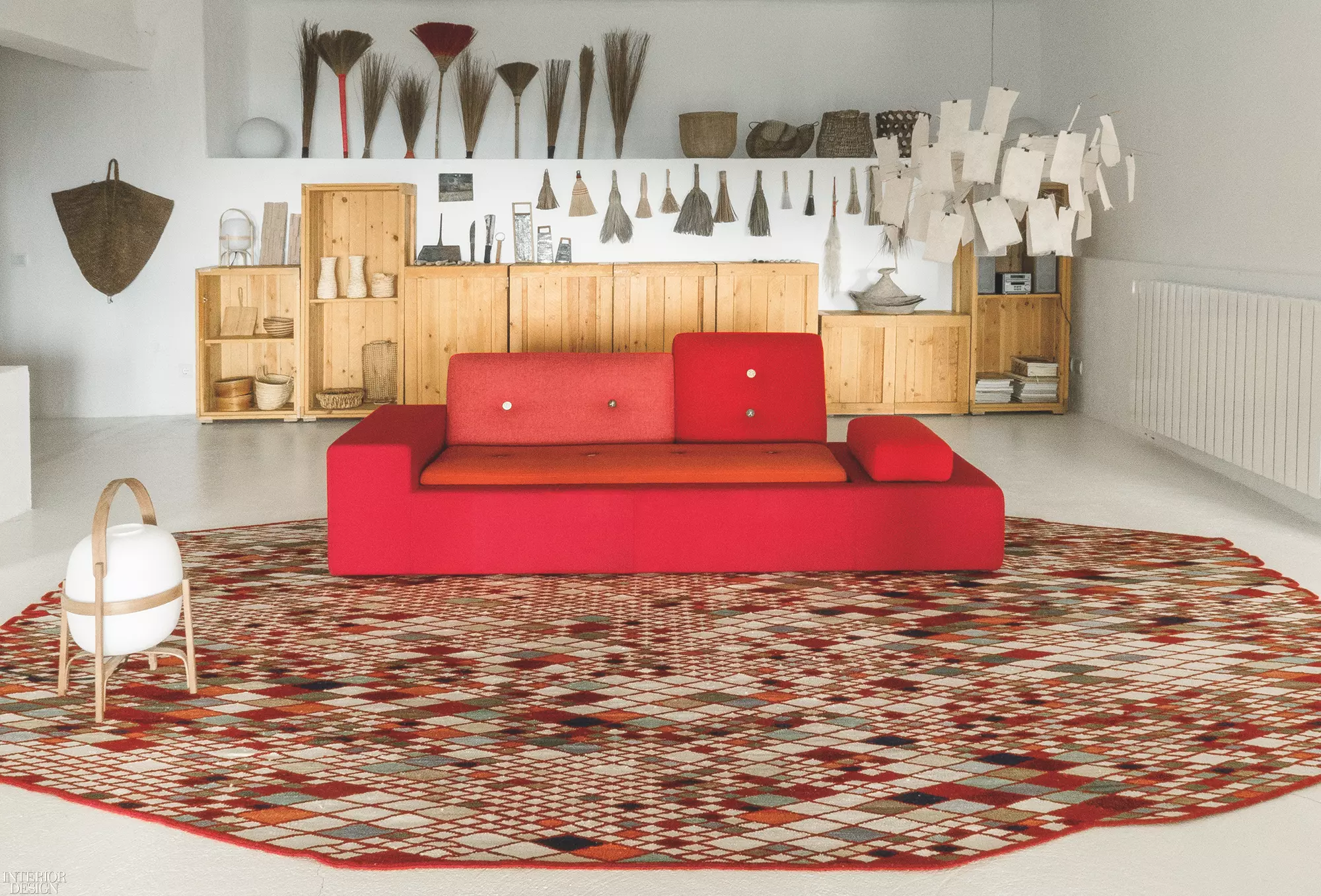 A red geometric couch in a modern country house