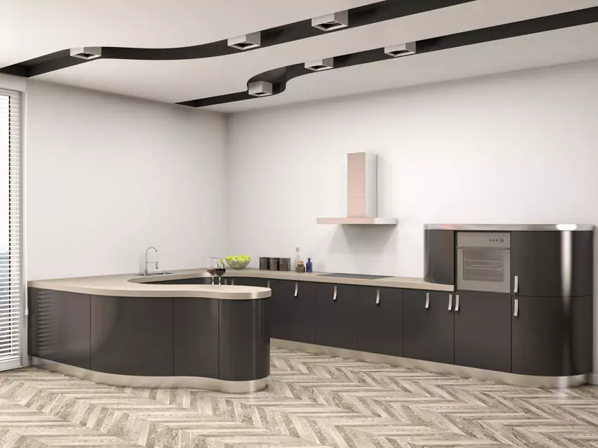 Kitchen with red backsplash, curved solid surface countertop and dual sink