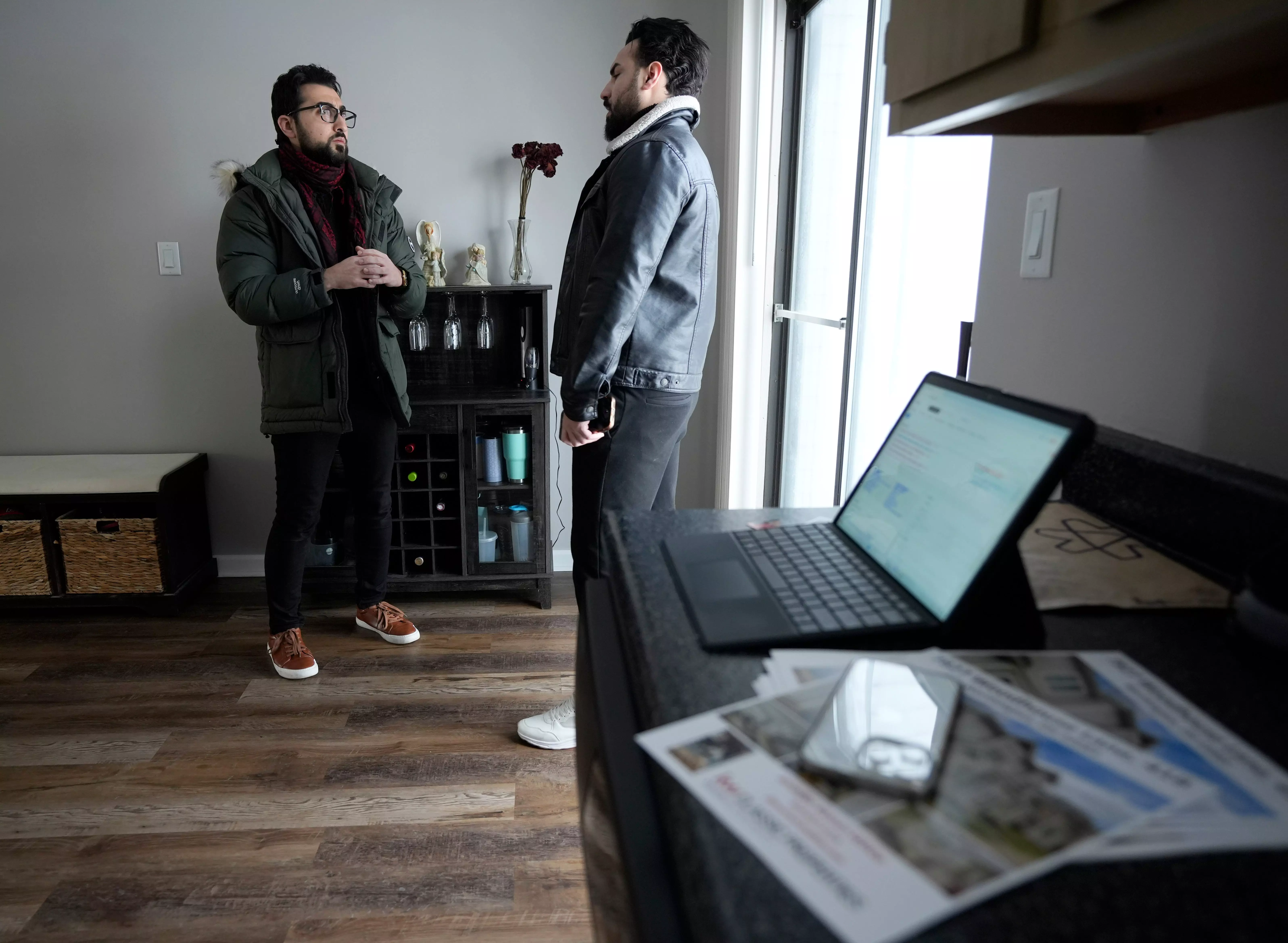 Sinan Falah, an Iraq refugee and real estate agent, shows a Worthington condominium on Sunday, Jan. 14, 2024, to buyer Mohamad Mizyan. Falah was among Coldwell Banker Realty
