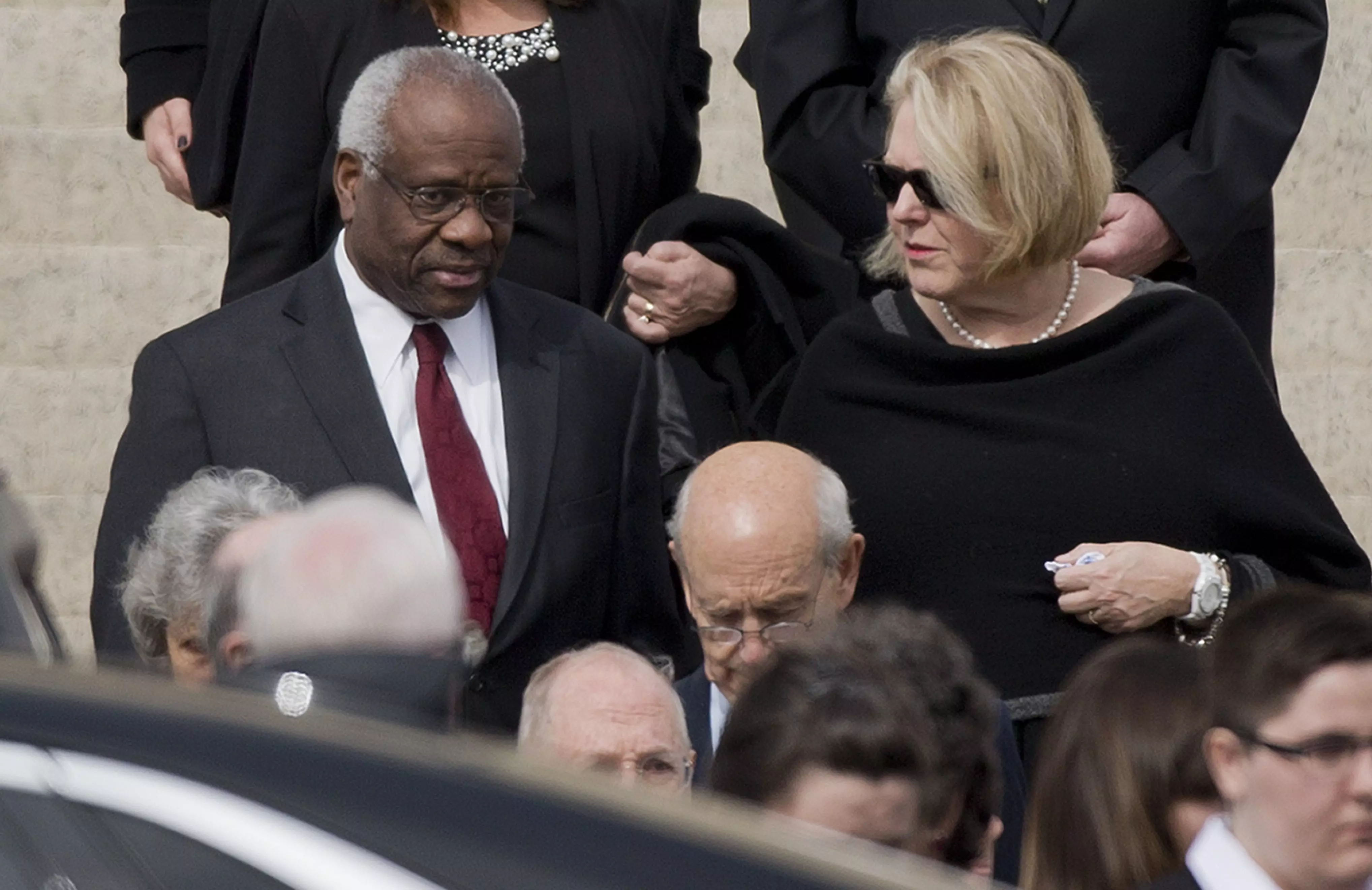 Supreme Court Justice Clarence Thomas and his wife, Ginni, leave funeral services for the late Justice Antonin Scalia.
