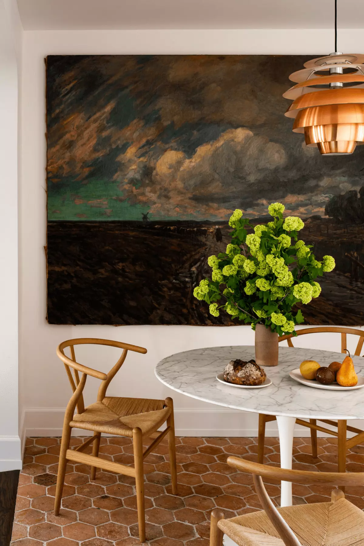 Scandinavian dining room showcasing a gallery wall, a classic Scandinavian interior addition