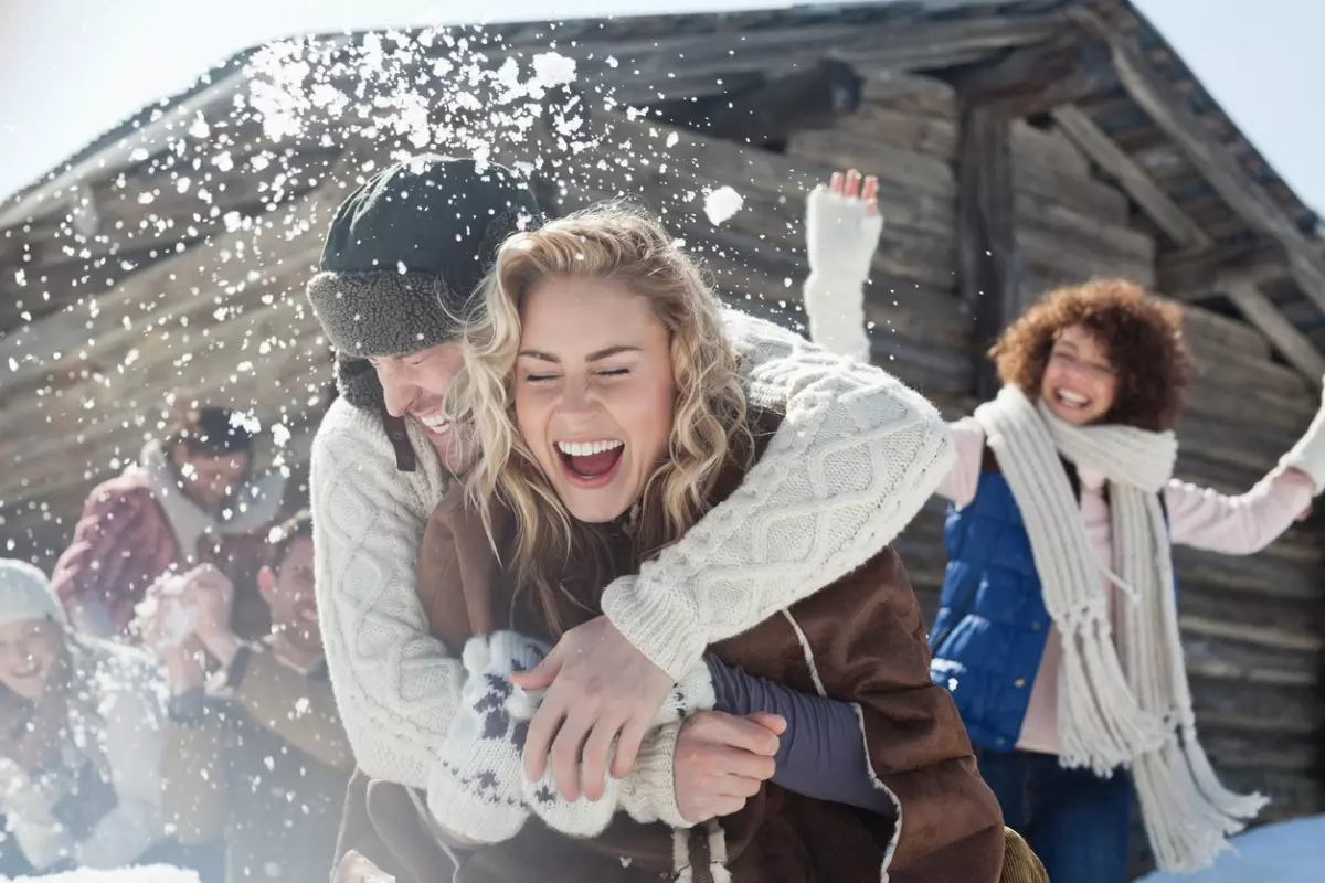 Young group of friends enjoying a snowy day