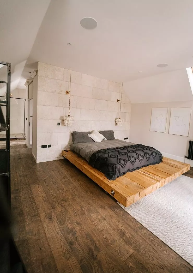 Bedroom with Dark Wood Ceiling and Barn Door