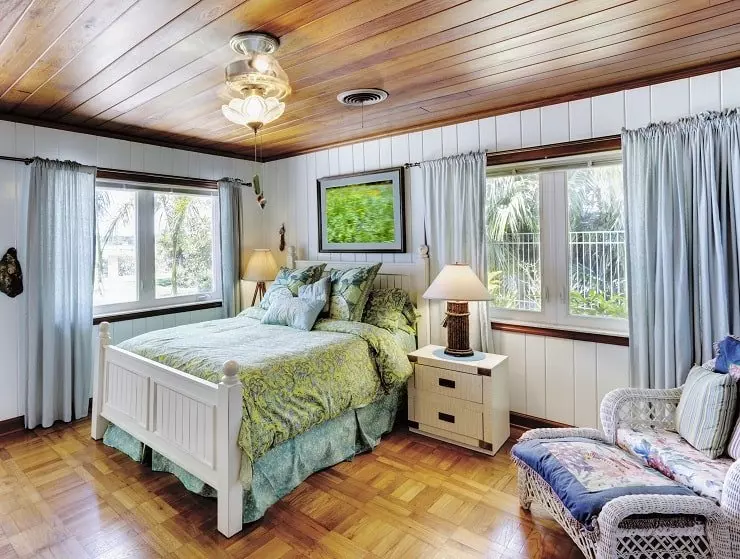 Black and White Bedroom with Dark Wood Floors and Furnishings