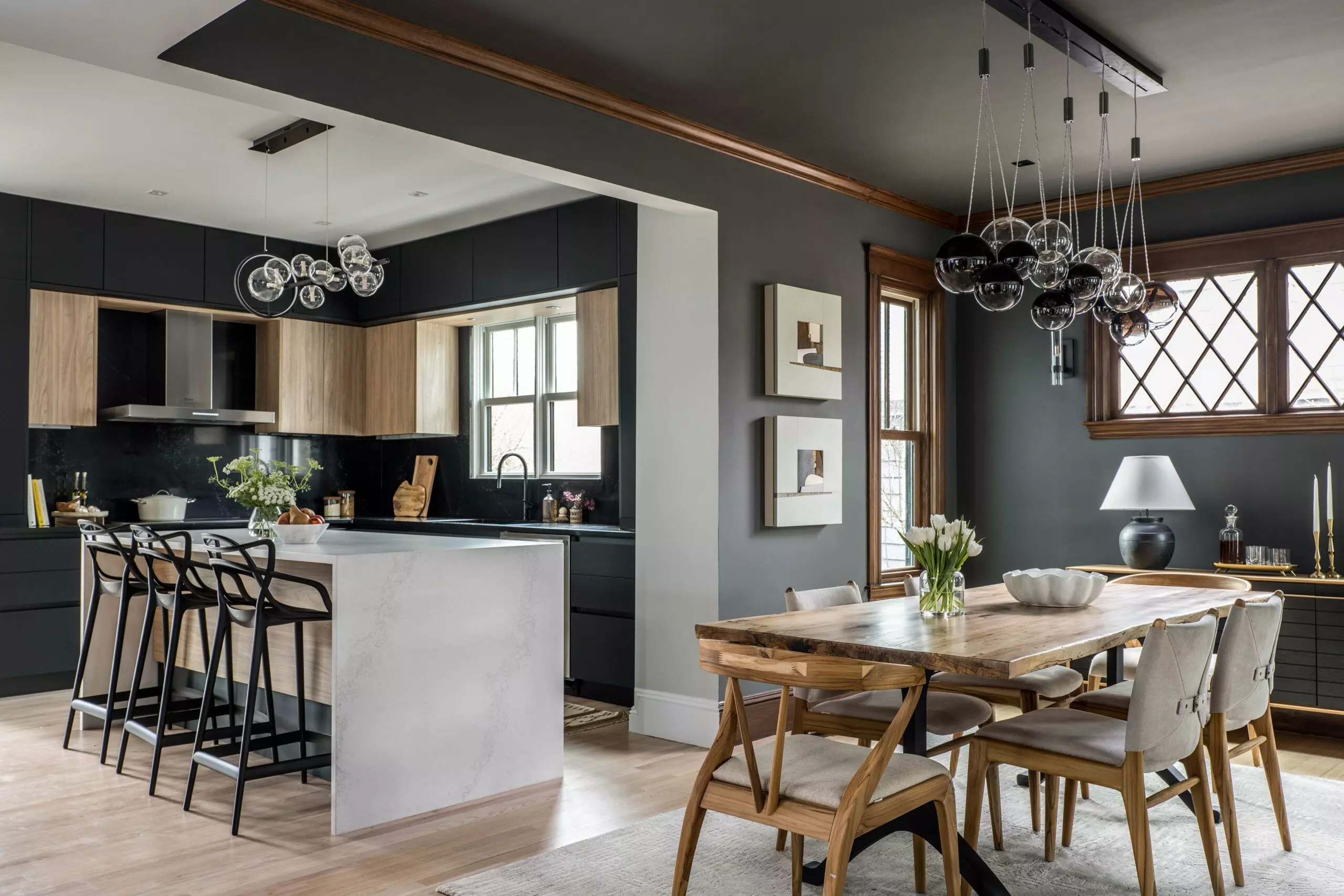 Dining Room and kitchen with multiple pendant lighting fixtures