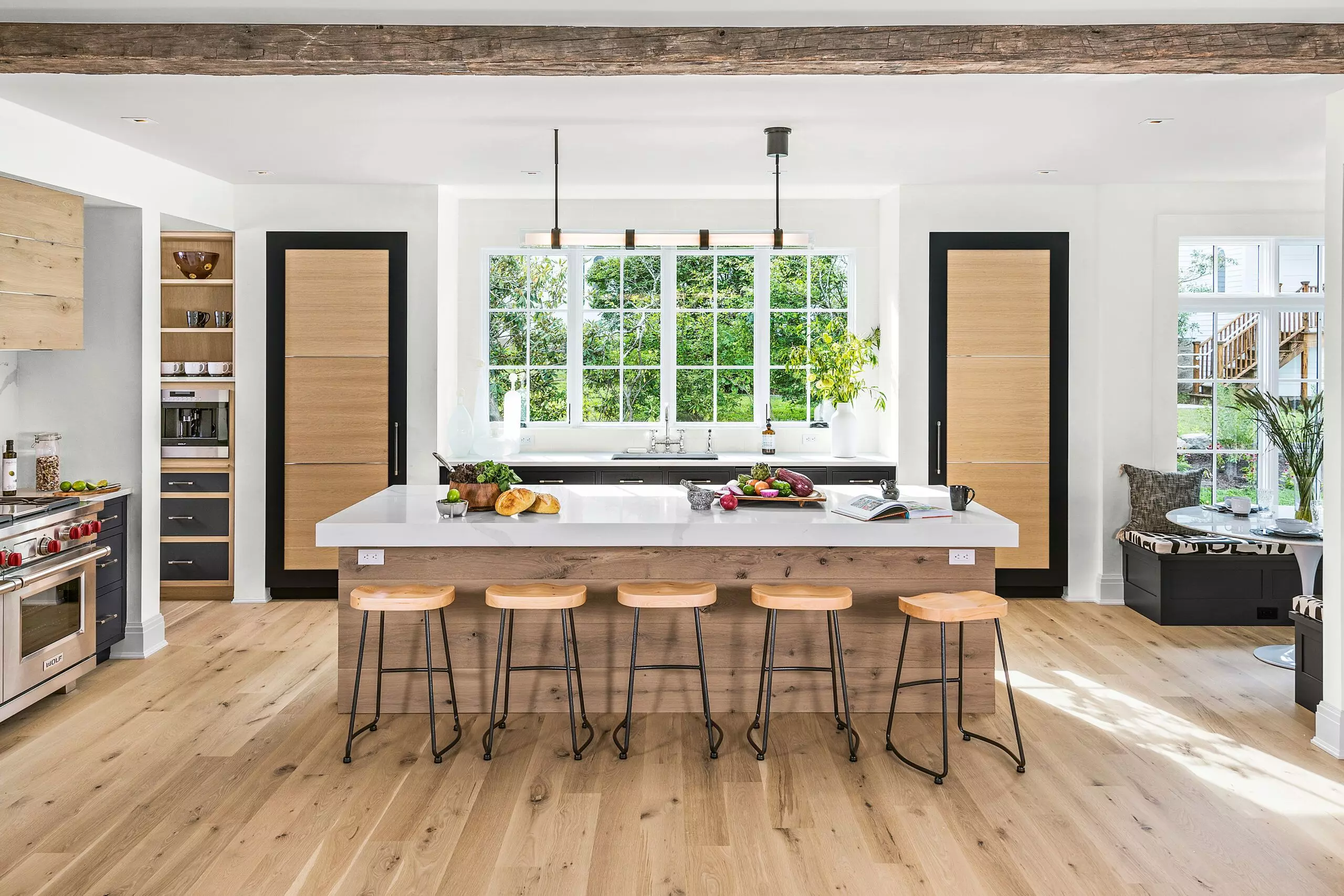 Kitchen Island with a long lighting fixture over it