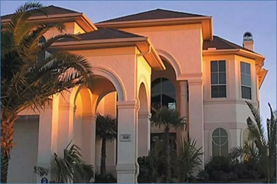 Two-story Spanish style house with covered courtyards called arcades