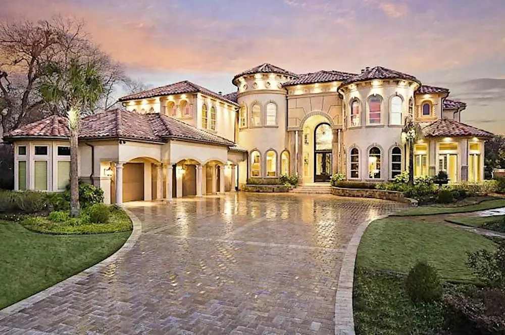 Ornate two-story Spanish style home with a tile roof and stucco siding