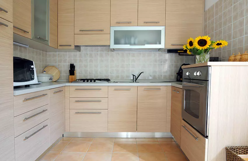 Kitchen with light-colored plywood cabinets