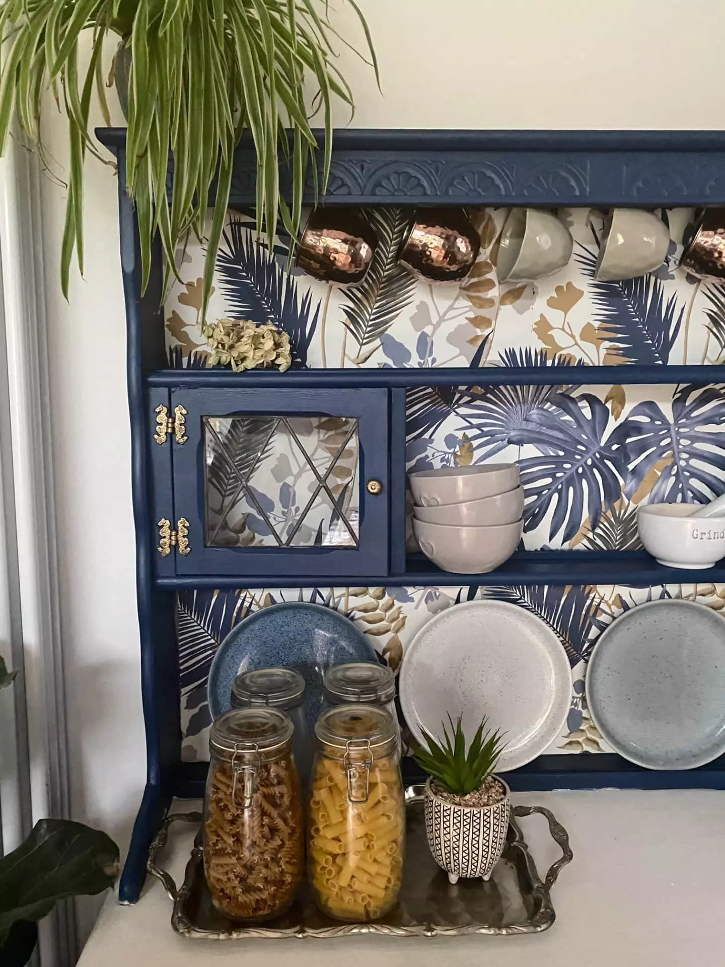 an upcycled welsh dresser with wallpaper