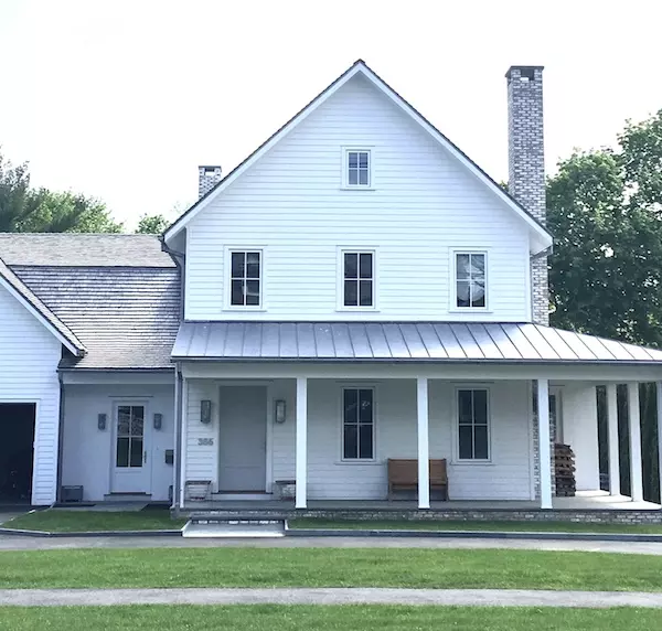 Custom Mix of Benjamin Moore Linen White and Benjamin Moore White Dove on the traditional home of Alex Kaehler.