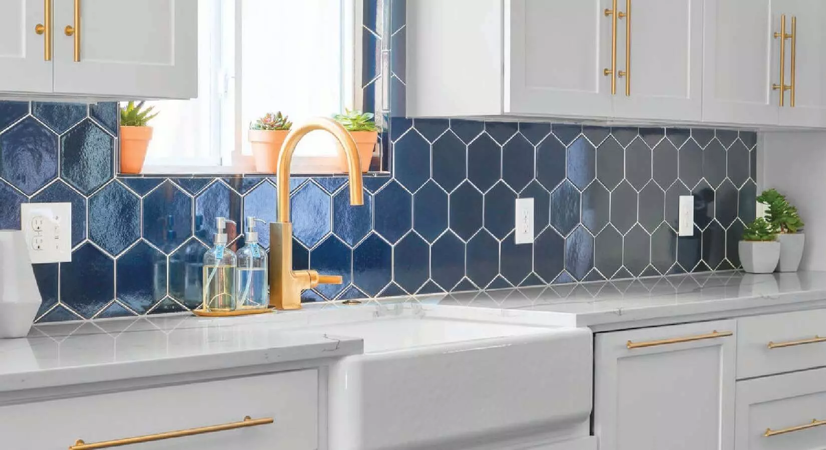 Kitchen with dark gray-blue cabinets, large butcher block island, and open wood shelves.