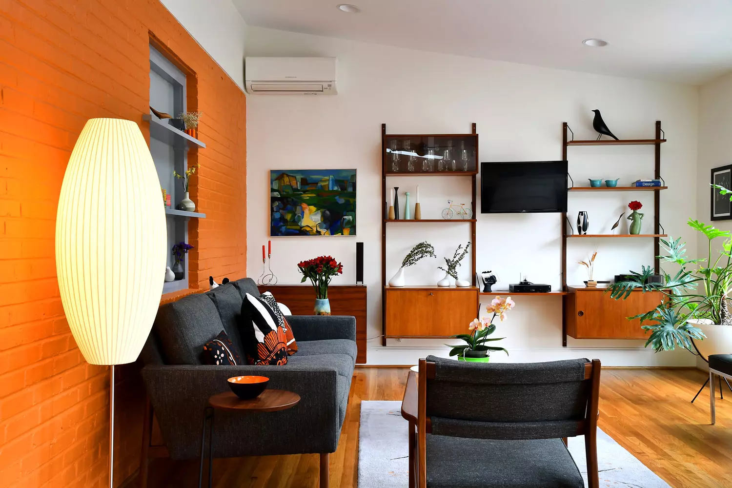 Lounge chairs with pillows in a room.