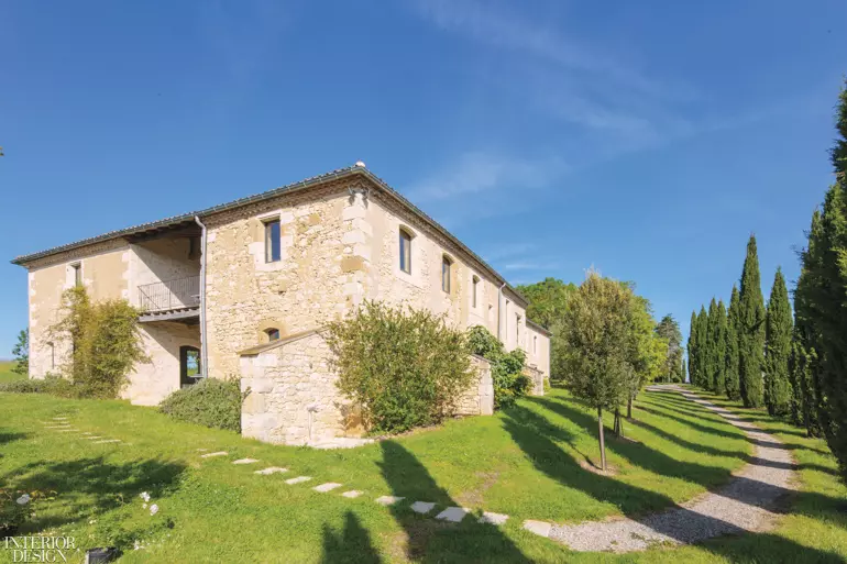 The exterior of the farmhouse, connected to the adjacent cow barn during the renovation