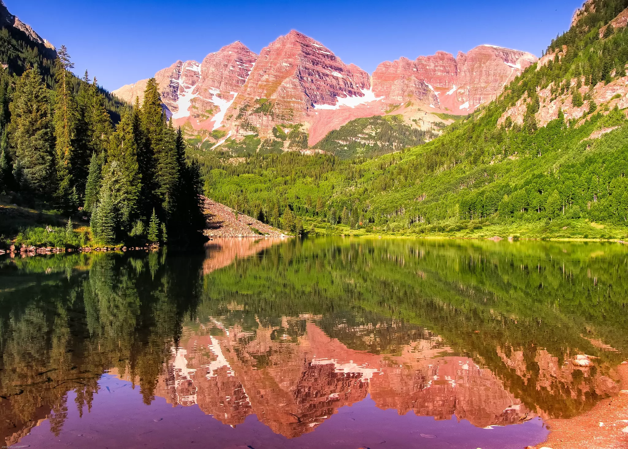 The Maroon Bells glowing in the summer