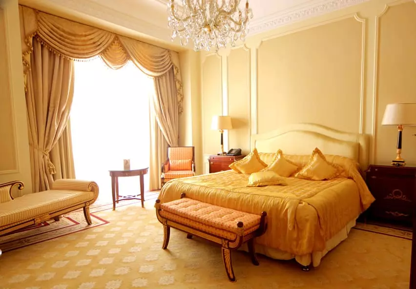 Luxury bedroom with curtain wall gold trim crystal chandelier