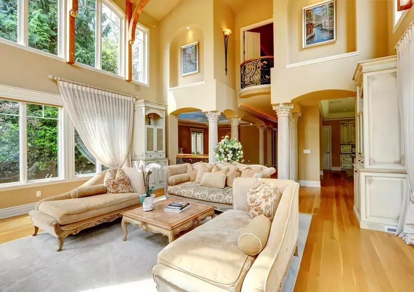 Midmodern Century inspired room with blue gray sofas with orange suede pillows