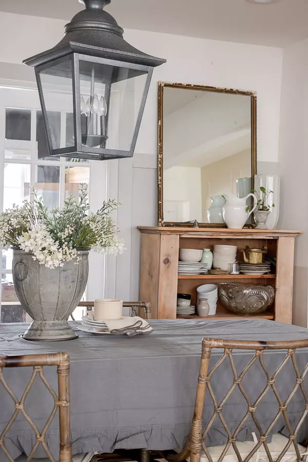 A pine cabinet filled with new and old dishes for that casual feel.