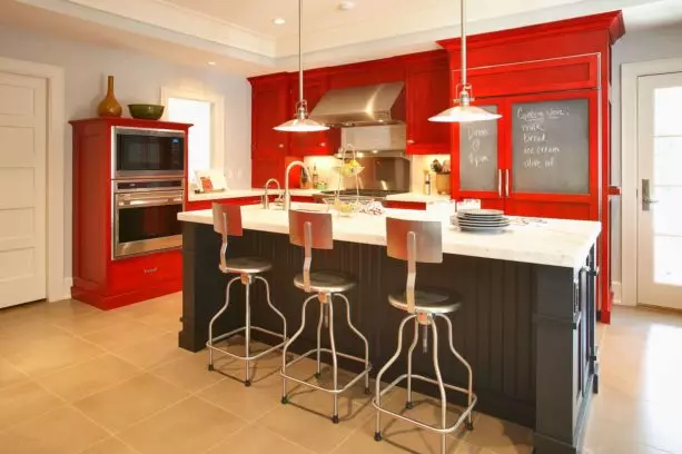 red and black kitchen design with stainless-steel appliances