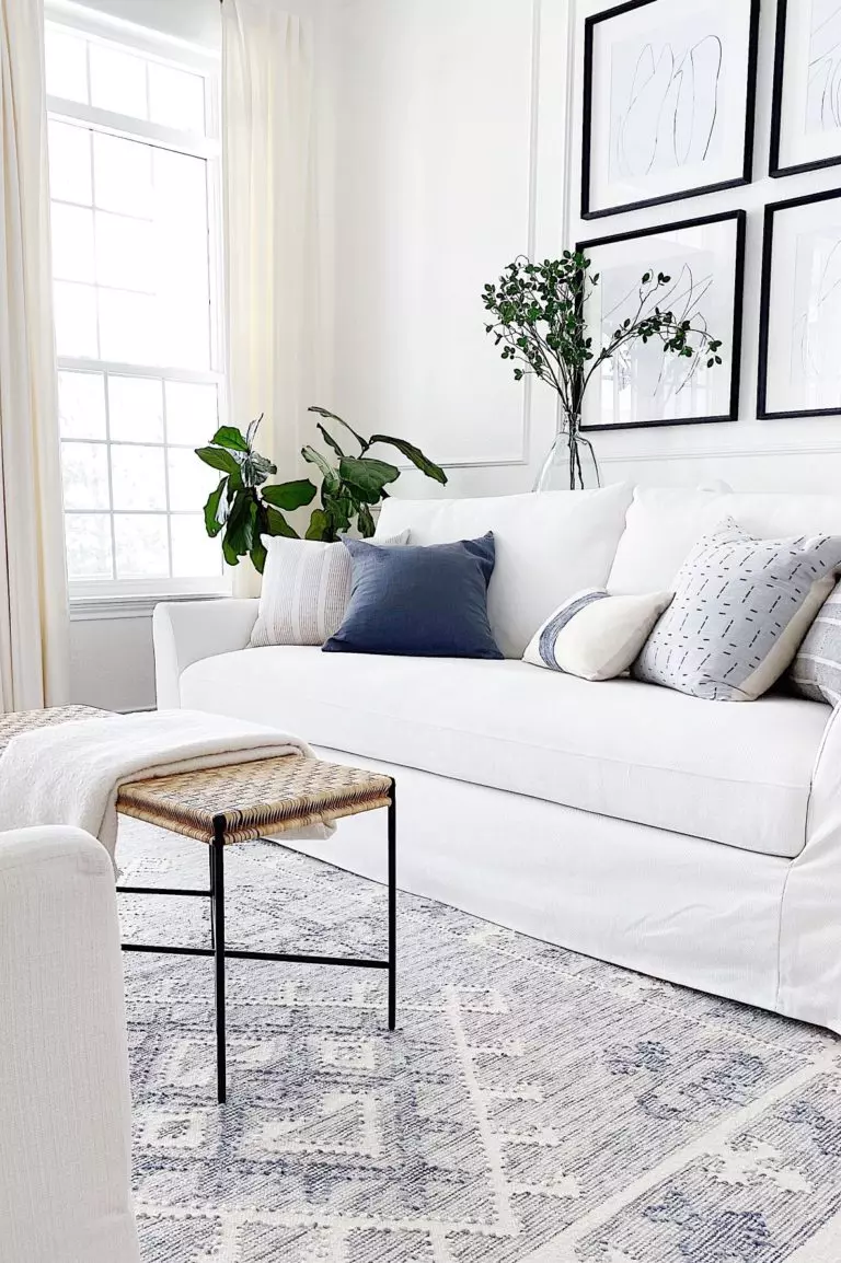 Our small living room with white slipcovered Ikea Farlov chairs and a round wood coffee table - jane at home - a review of my IKEA farlov sofa and chairs