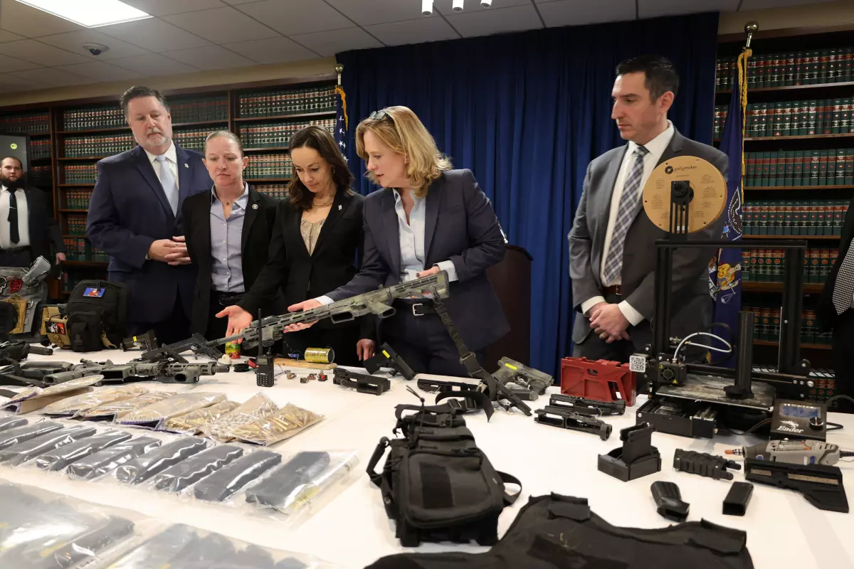 A police raid of a New York apartment yielded a large amount of weapons as shown in a photo from the Queens District Attorney