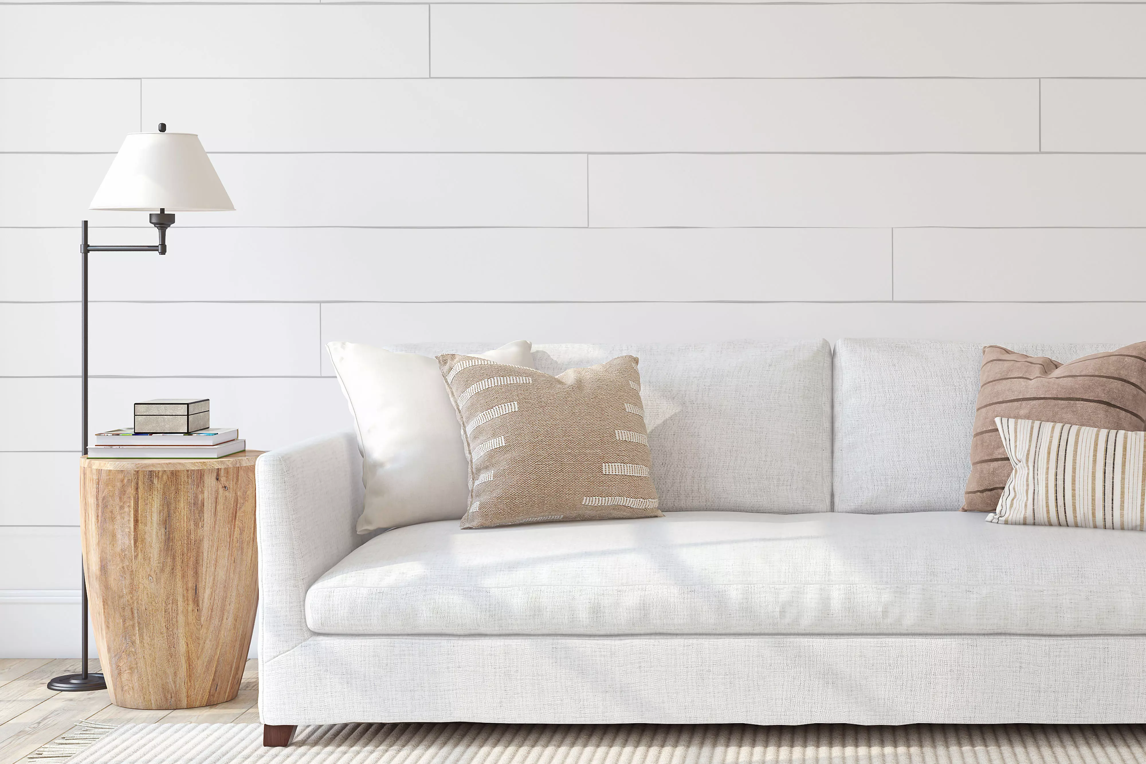 Modern farmhouse style couch with shiplap wall