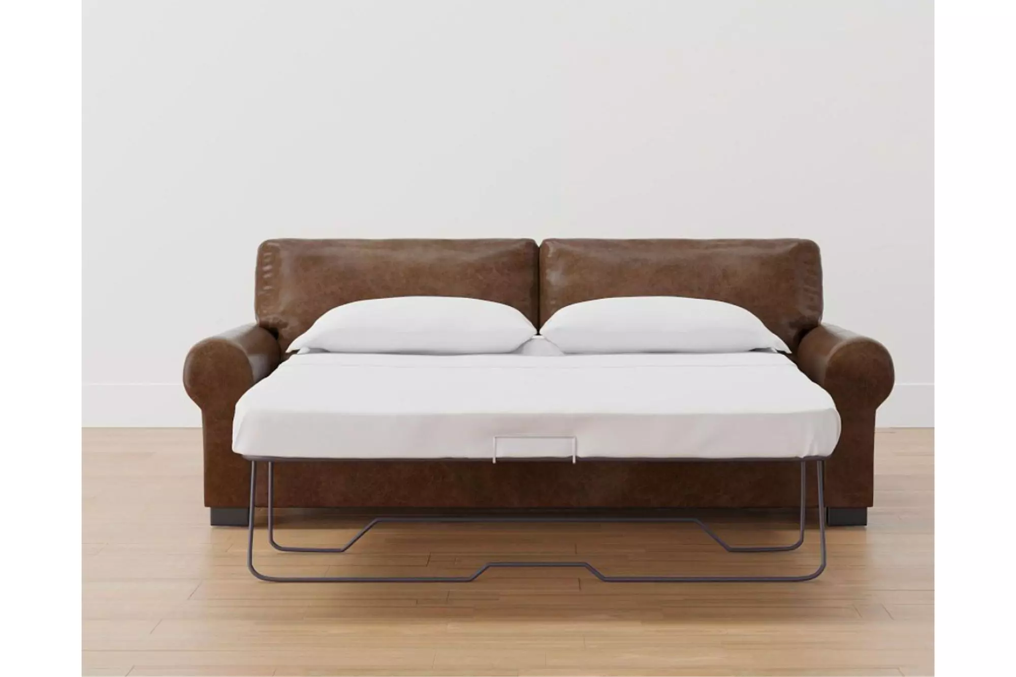 Brown leather loveseat with a pullout bed.