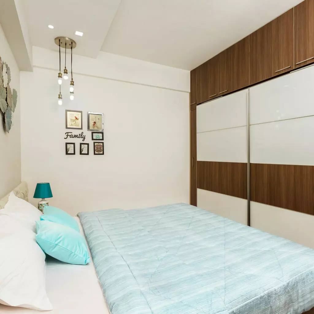 Sliding door wardrobe designs for the bedroom with mirrored and patterned sliding doors combine to make the bedroom look