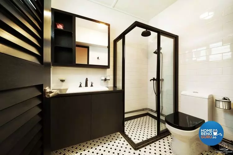 Bathroom with solid black furniture and hexagonal-shaped tiles
