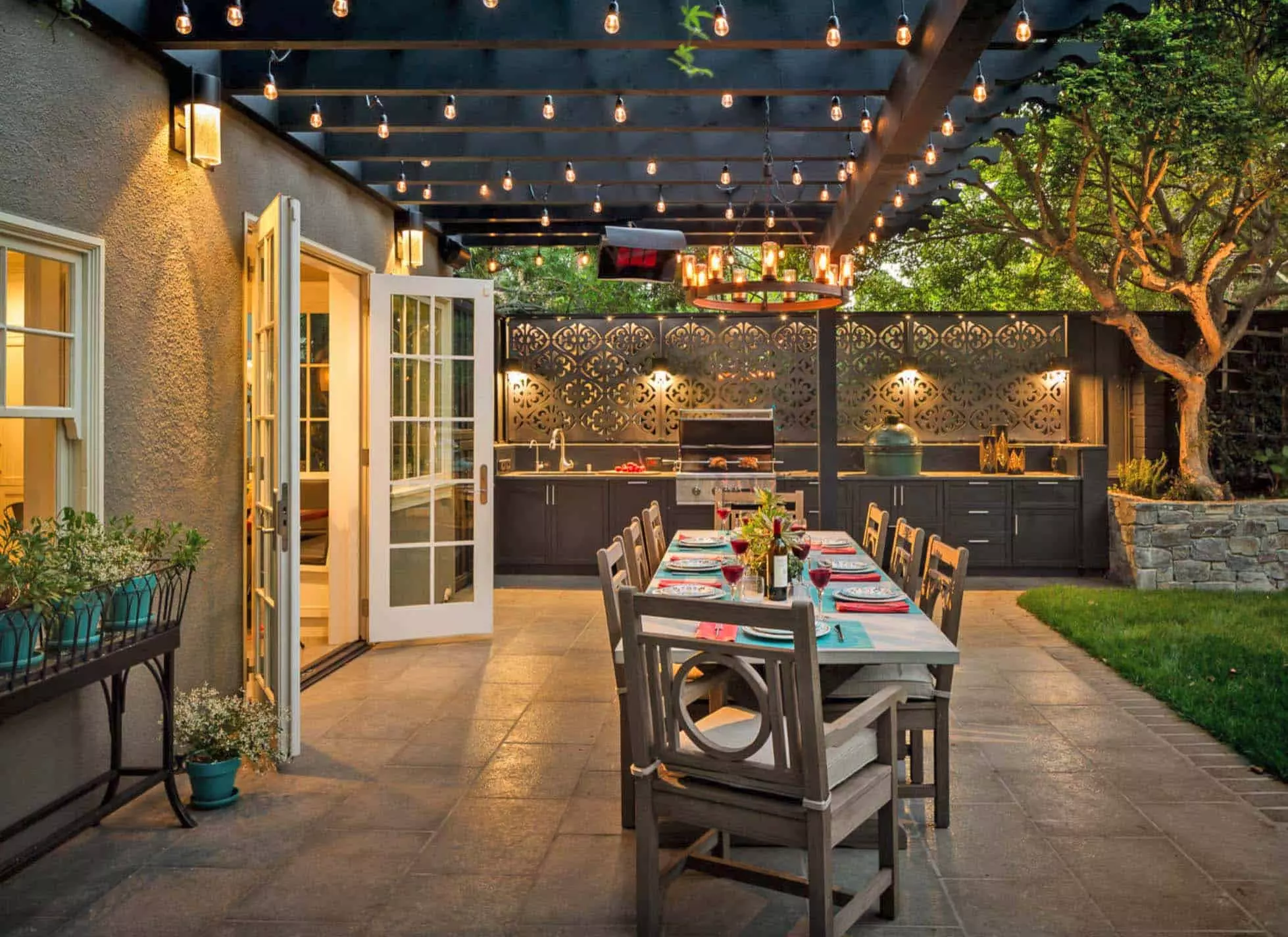 Outdoor dining area with kitchen and pergola