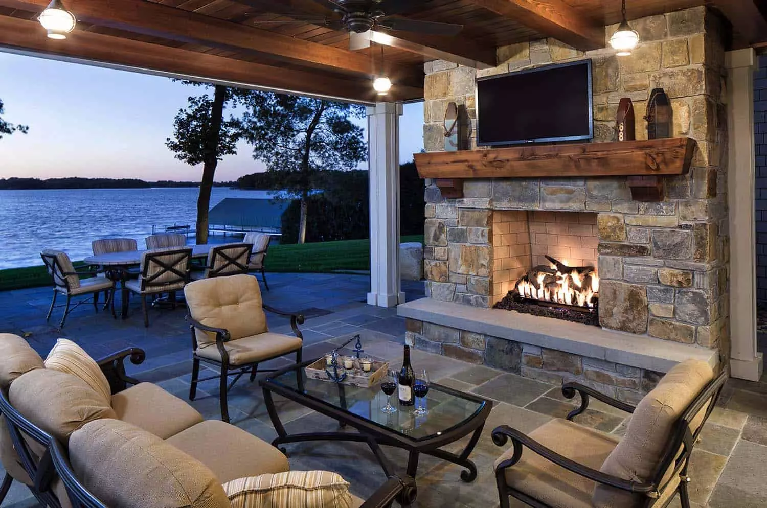 Covered outdoor living space with fireplace