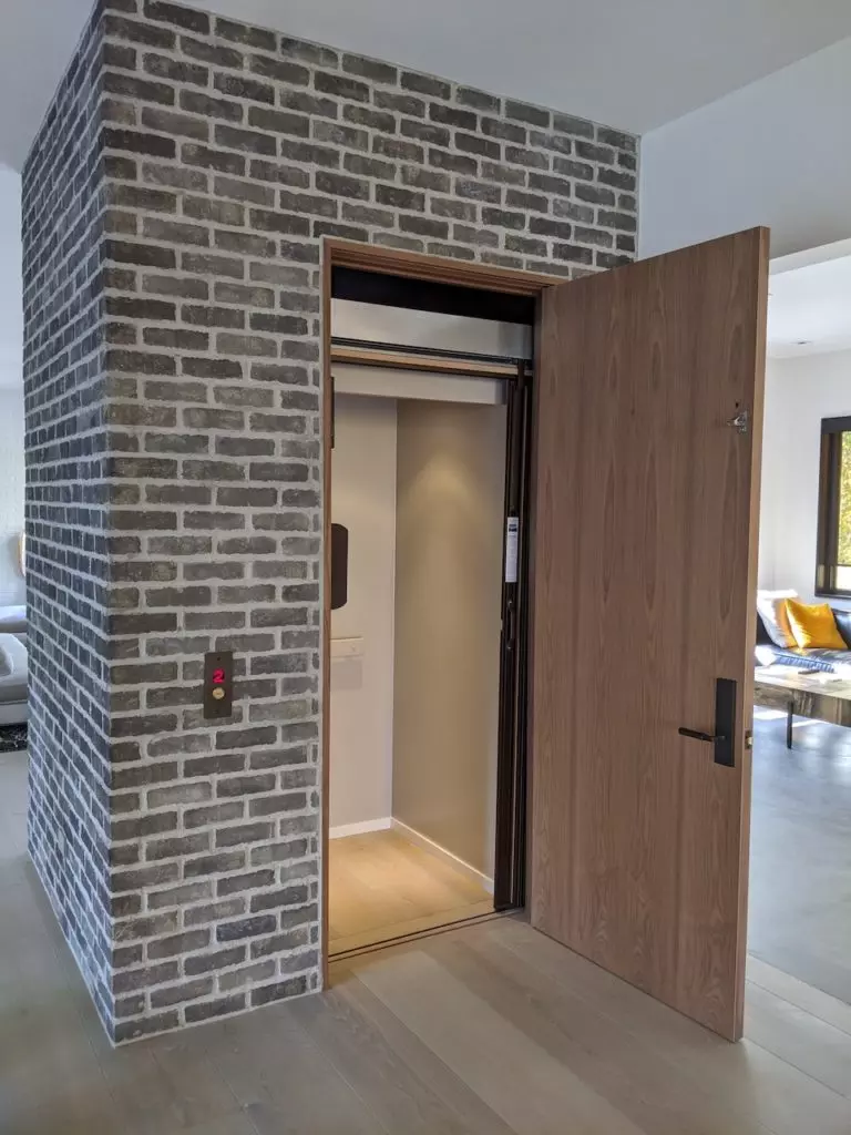 wood and glass accents in a home elevator