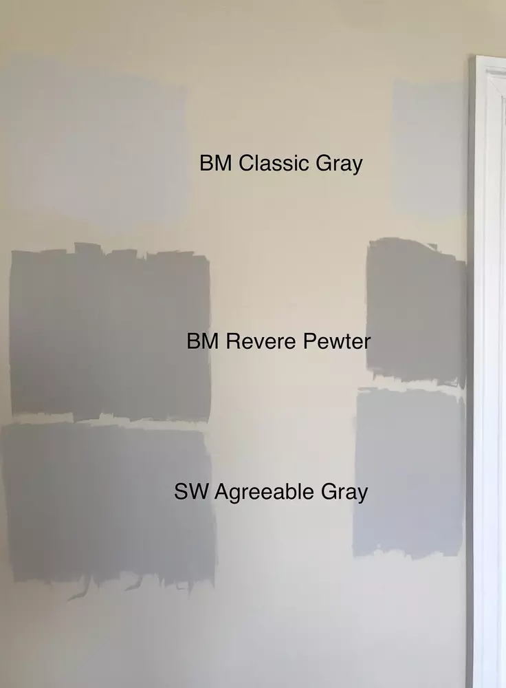 Assortment of gray paint sample containers