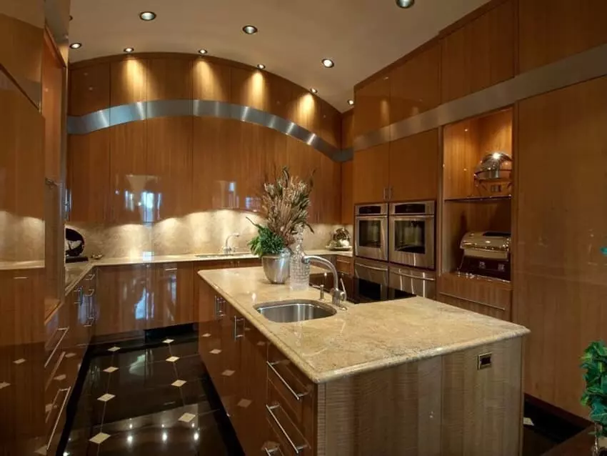 Two modern kitchen islands placed adjacent to each other with light brown stone tops